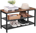 Industrial shoe bench angled view with books hat flower pot on top wicker basket and sneakers on lower shelves