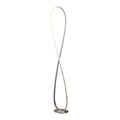 Chrome infinity-loop LED floor lamp on white background, figure-8 twisted design with warm white LED light along inner edge