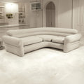 Beige inflatable corner sectional sofa styled in minimalist white and grey living room setting