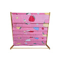 Pink fabric children's book display rack with bamboo frame, empty, front view showing strawberry and flower print fabric