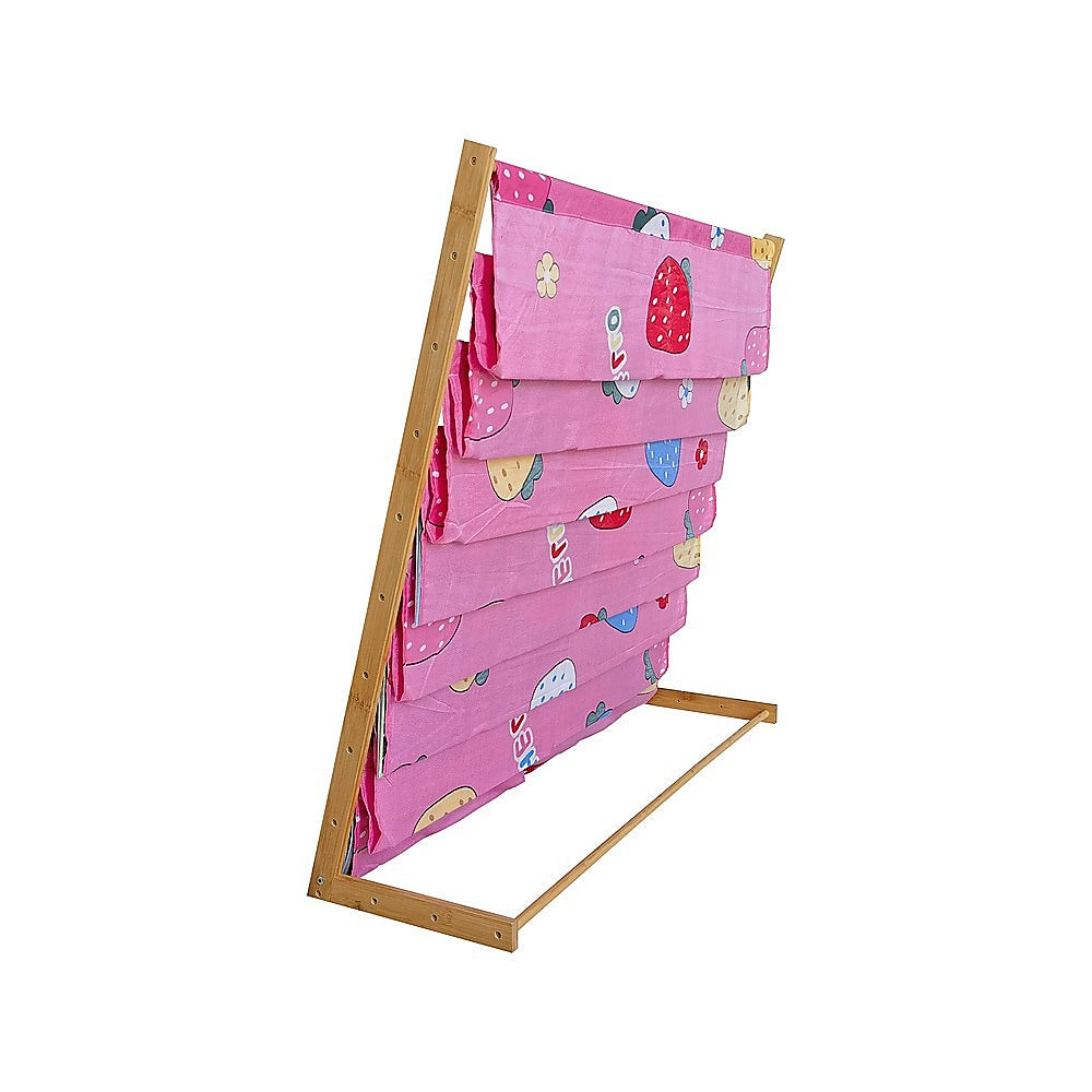 Pink fabric children's book display rack, empty, side view showing angled bamboo A-frame structure on white background