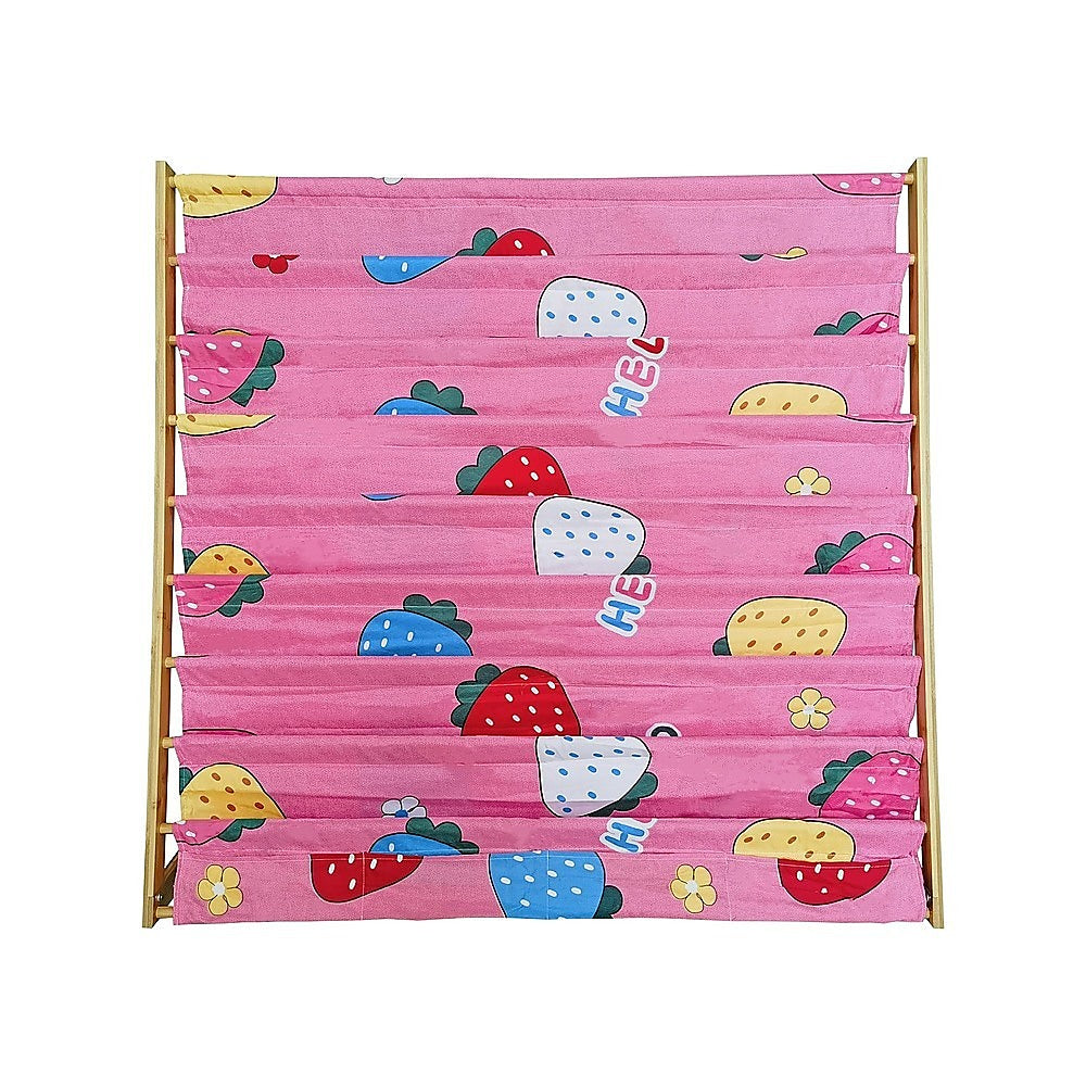 Close-up front view of pink strawberry-print fabric book display rack, empty pockets, bamboo uprights visible on sides