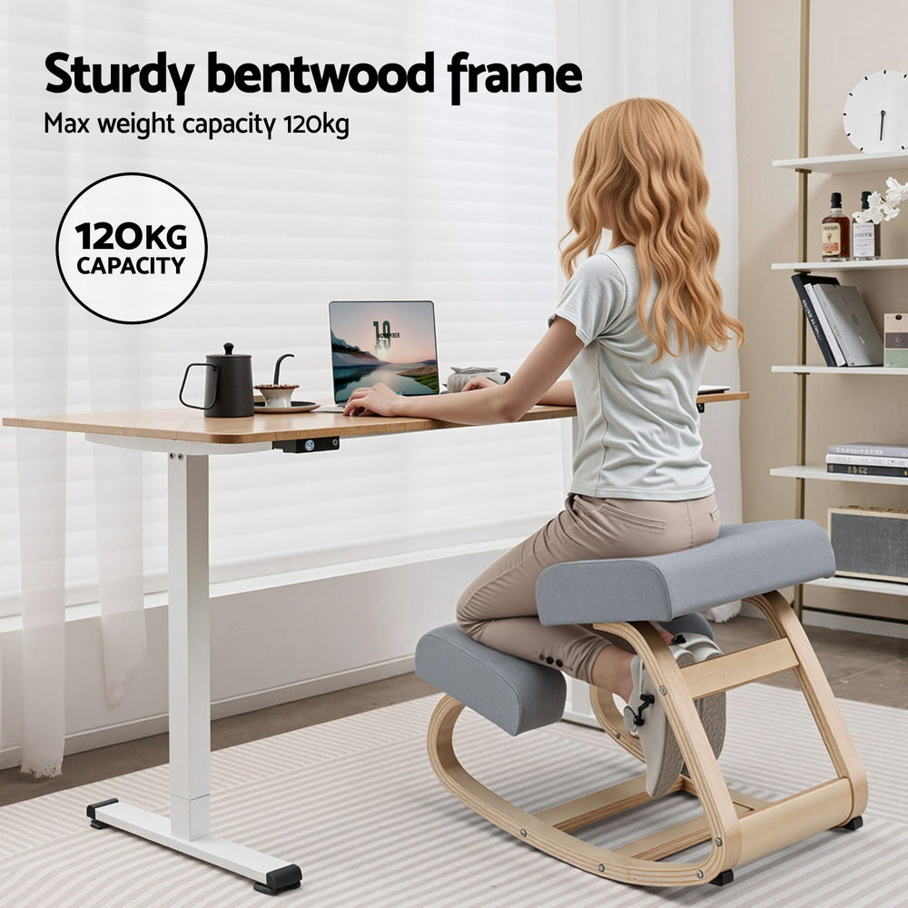 Woman seated on grey kneeling rocker chair at standing desk, 120kg capacity badge, sturdy bentwood frame infographic