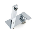 Isometric view of polished chrome wall-mounted faucet long rectangular spout controls