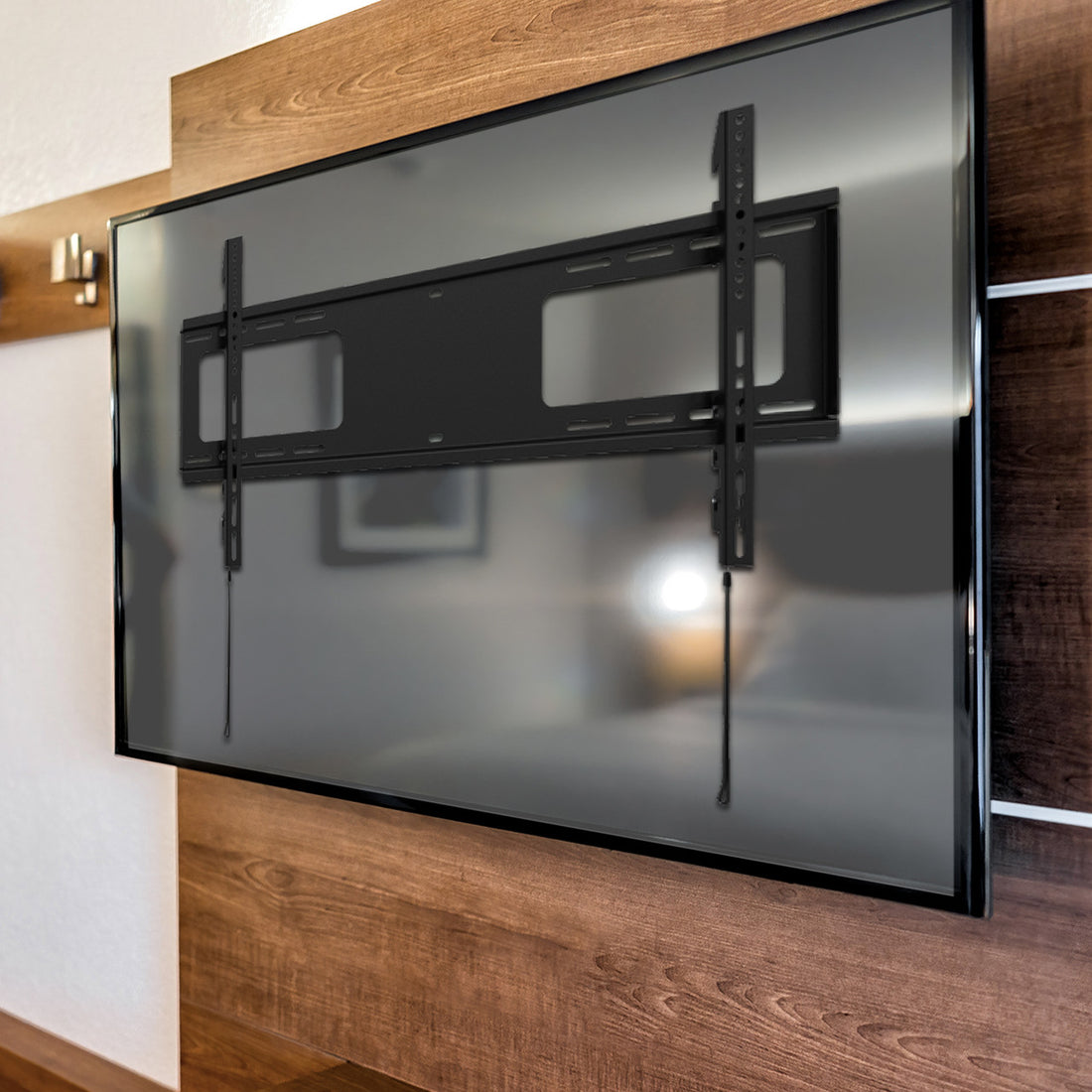Black large fixed TV wall bracket flat front view on white two square cutouts two cable wires and height adjustment rails