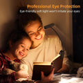 Adult and child reading in bed with black LED clip-on book light, text reads Professional Eye Protection