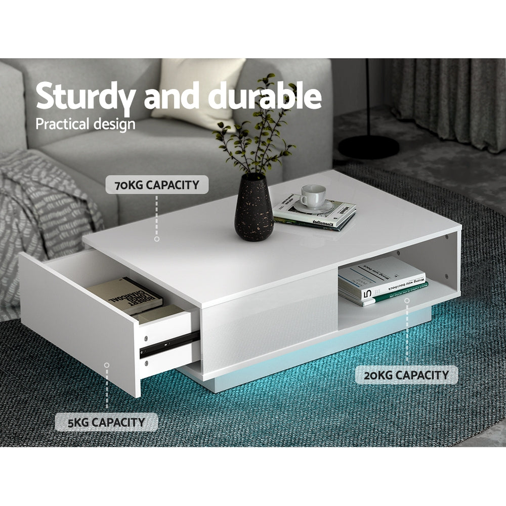 White LED coffee table with an open drawer showing 5KG capacity label, open shelf with 20KG capacity label, and 70KG top
