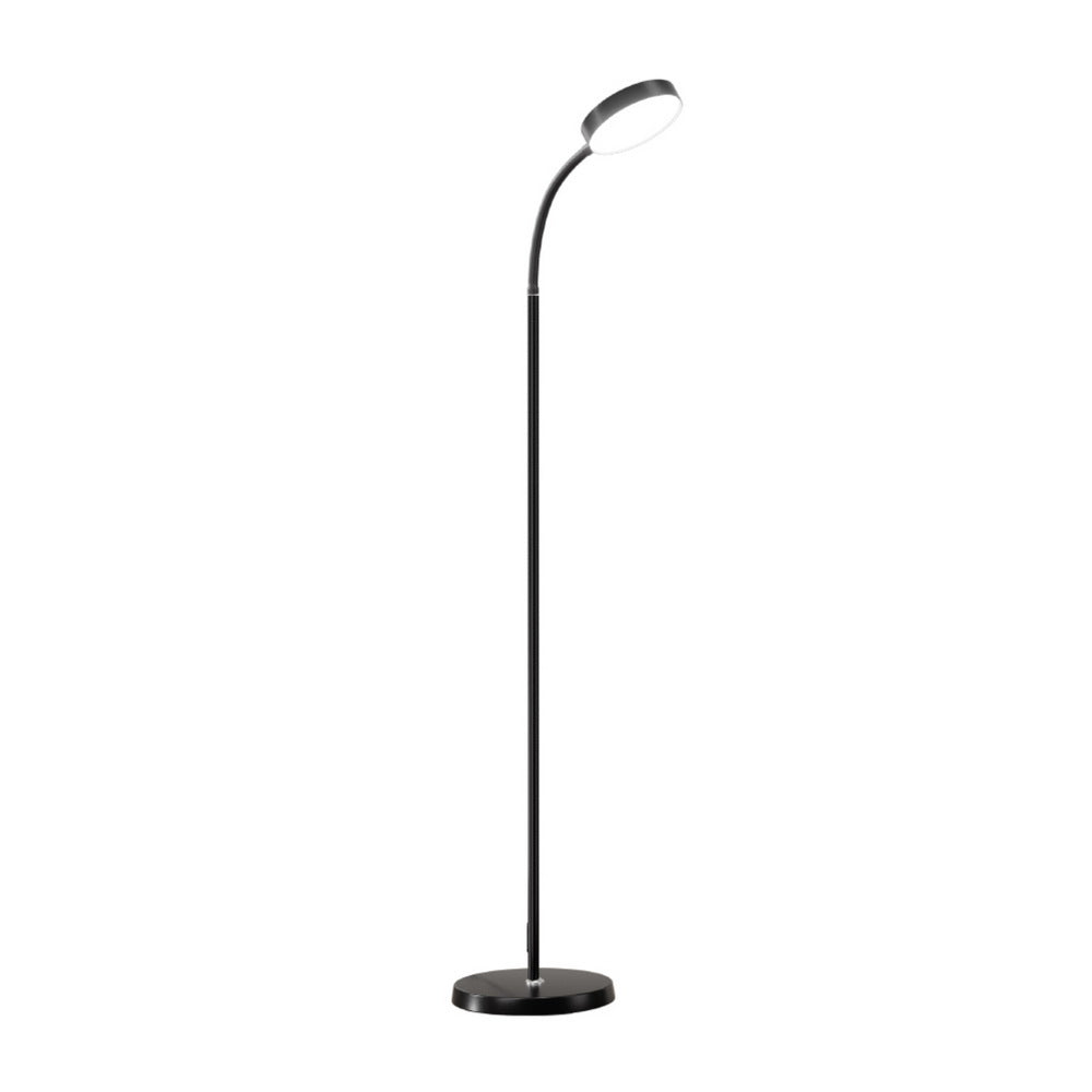 Black LED gooseneck floor lamp with round disc head and circular weighted base, side angle view on white background