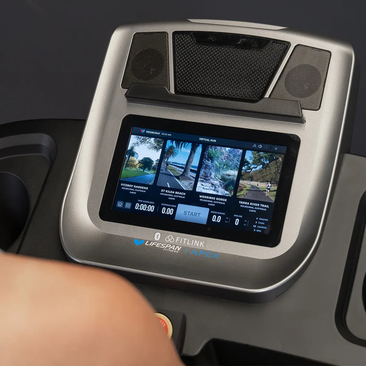 Apex 2 10.1 inch display showing virtual run trails from Australian locations with scenic landscapes