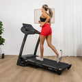 Woman running on Lifespan Boost 2 in home gym with wooden floor and plant