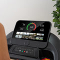 Boost 2 tablet showing virtual trail running routes with scenic locations