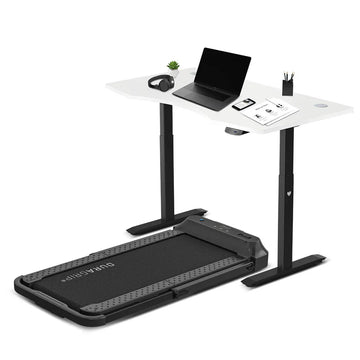 Lifespan V-FOLD treadmill with ErgoDesk standing desk showing laptop setup on white surface