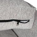 Close-up of light grey sofa seat cushion cover showing black zipper closure on reverse side