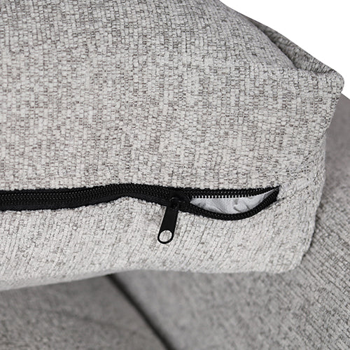 Close-up of light grey sofa seat cushion cover showing black zipper closure on reverse side