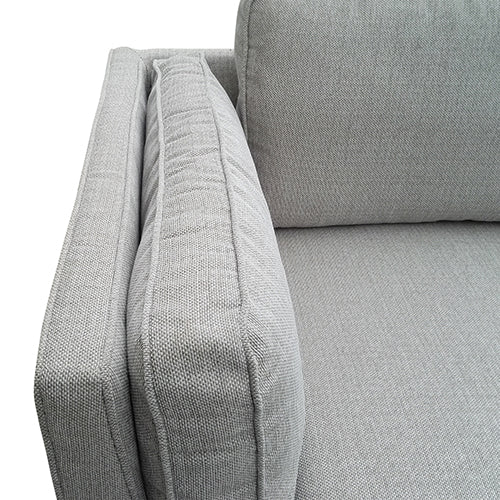 Light grey fabric 3-seater sofa close-up of armrest face showing woven fabric texture and piped seam