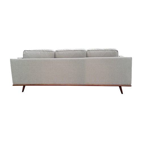 Light grey fabric 3-seater sofa rear view showing plain back panel and wooden base rail from behind