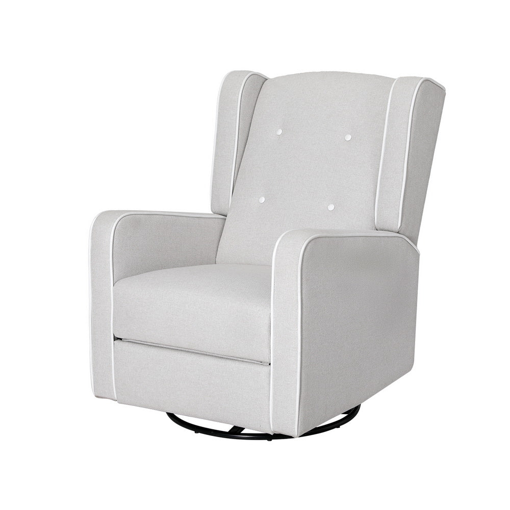 Light grey fabric wingback recliner with button-tufted backrest, white piping trim and black swivel base, three-quarter view