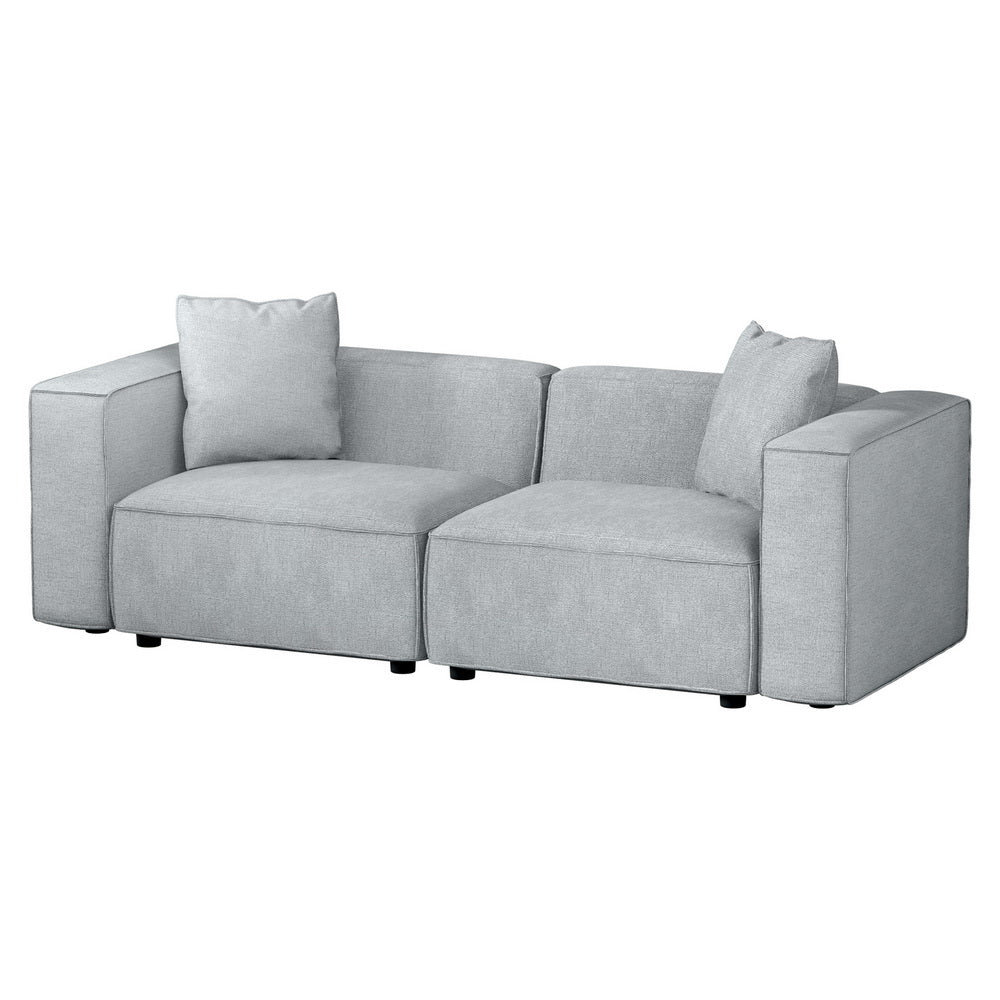 Angle view of light grey linen 2-seater modular sofa with rounded arms on white background