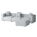 Light grey modular 3-seater sofa with matching ottoman on right, angle view on white background