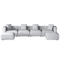 Light grey modular 4-seater sofa with ottomans on both sides, front view on white background
