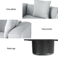 Feature infographic for light grey modular sofa showing extra pillows, track armrest, and plastic legs detail