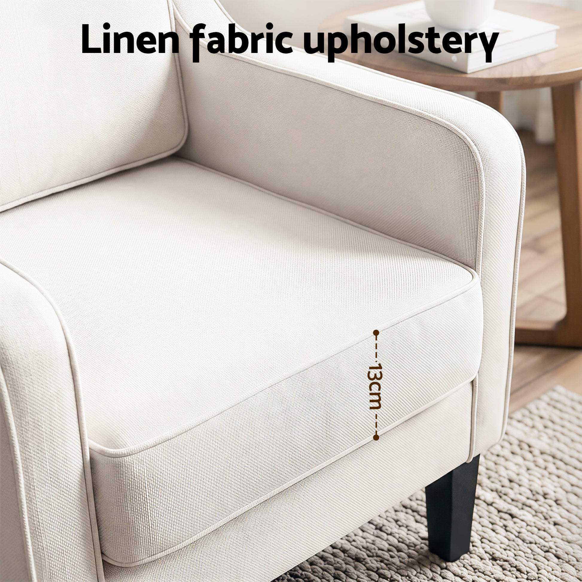 Close-up of beige linen armchair seat labelled "Linen fabric upholstery" showing 13cm cushion thickness