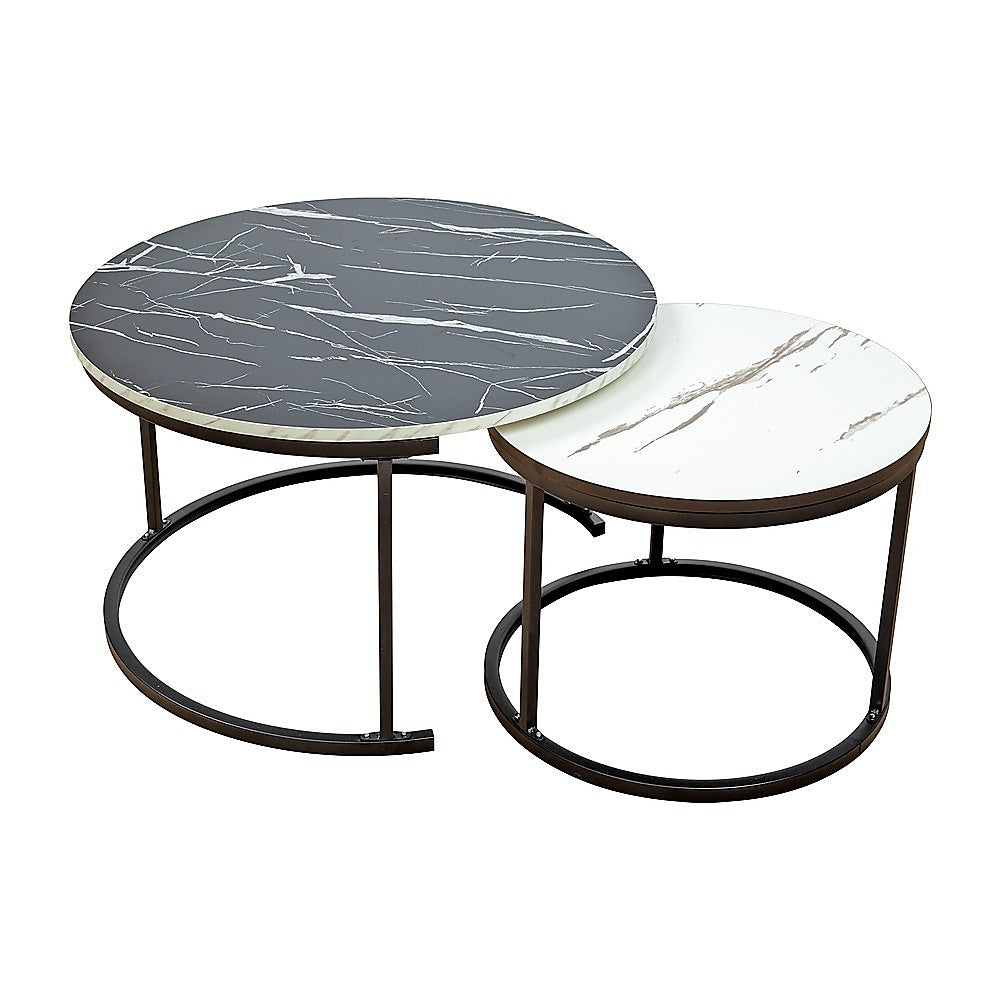 Two round nesting coffee tables separated: larger with black marble top and smaller with white marble top, bronze ring bases