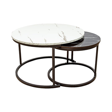 Two round nesting coffee tables with white marble and black marble tops on bronze metal ring bases on white background