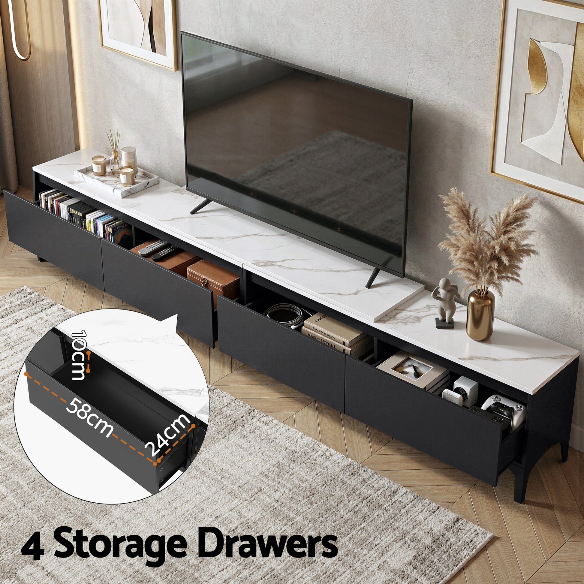 Black marble-top TV unit four drawers open 58x24x10cm with books and decor on marble top and wall-mounted TV