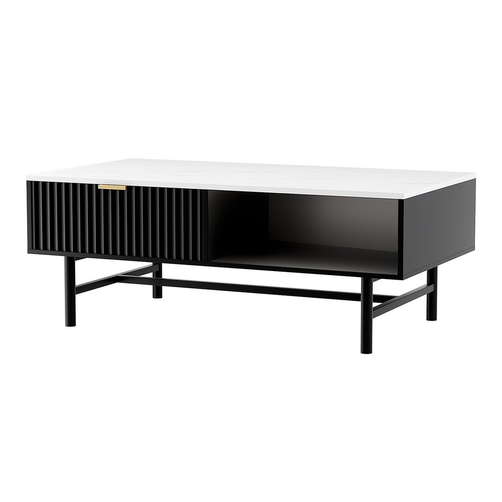 Coffee table with white marble top, black ribbed drawer with gold handle and open shelf, black metal legs, white background