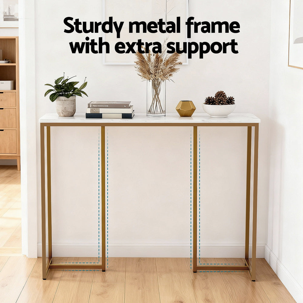 Marble-top console table with gold frame and highlighted support struts, text "Sturdy metal frame with extra support"