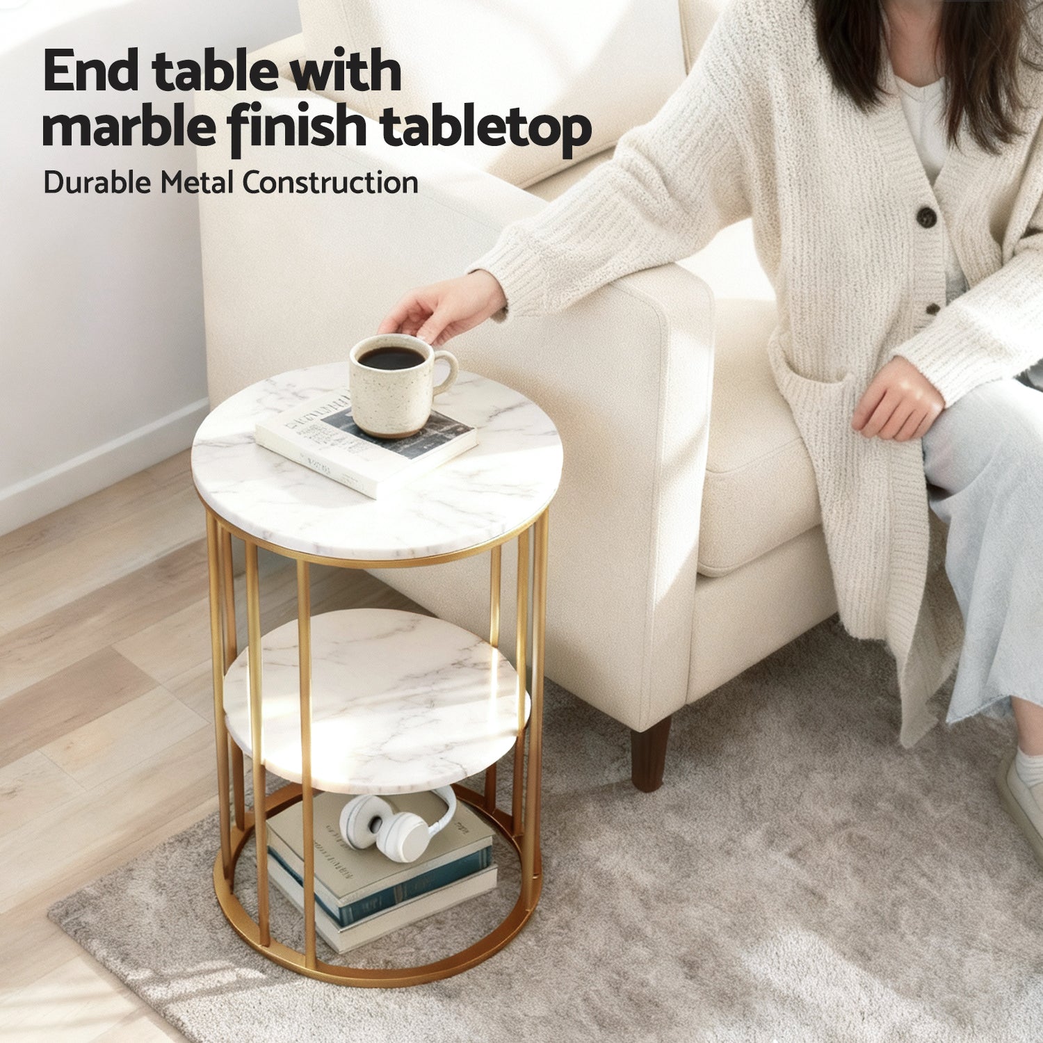 Round end table with marble finish top and gold cage frame beside armchair, text: End table with marble finish tabletop