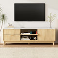 White marble-top TV unit with ribbed oak doors two open center shelves and round wood legs in white room