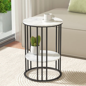 Round two-tier side table with white marble-look shelves and black cage metal frame, cup on top, cactus on lower shelf