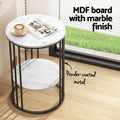 Round two-tier side table with marble finish MDF top and powder-coated metal frame, text callout labels, black cage frame