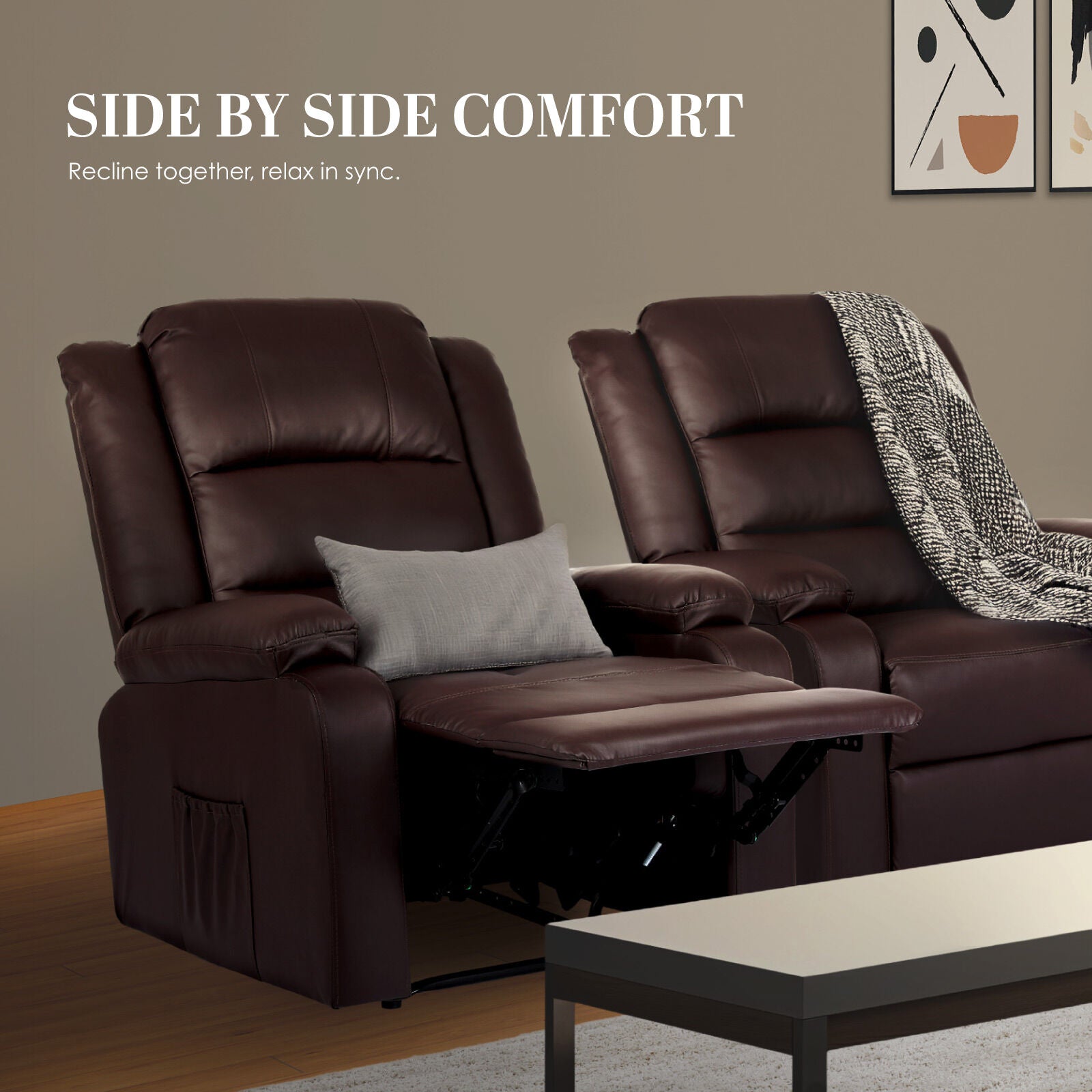 Two dark brown PU leather recliner chairs side by side, one with footrest extended and grey cushion, one with throw blanket