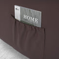 Close-up of dark brown PU leather recliner side pocket with a Home Interior Design magazine inserted