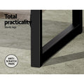 Close-up of black metal bookcase legs on concrete floor; text reads Total practicality, sturdy legs, anti-scratch pads