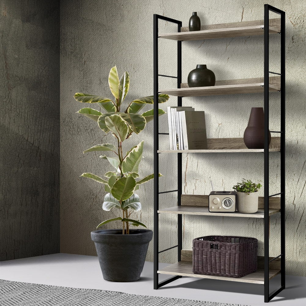 5-shelf metal frame bookcase in black and oak, styled with vases, books, radio and wicker basket in textured wall room scene