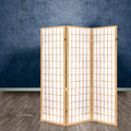 Natural pine 3-panel standard grid shoji room divider in lifestyle room with blue textured concrete wall and wood floor