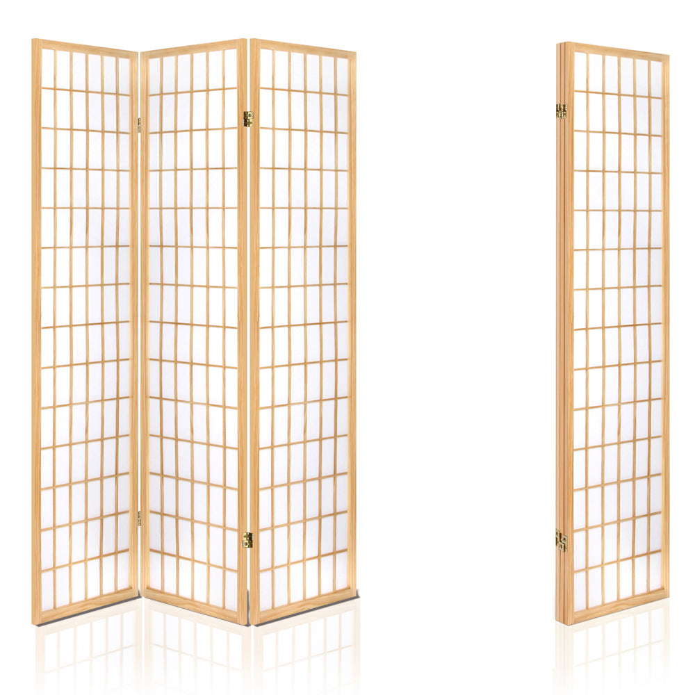 Natural pine 3-panel simple grid shoji room divider in industrial studio lifestyle with concrete wall and diamond rug