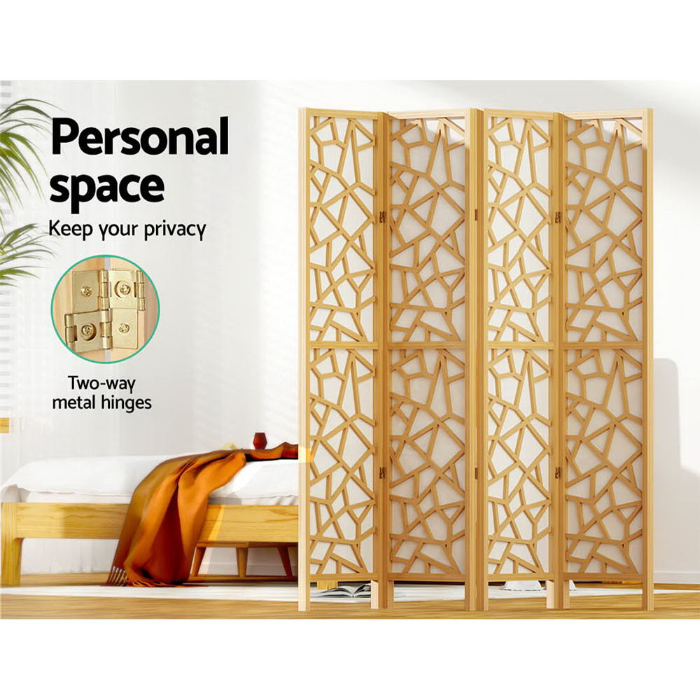 Natural pine 4-panel criss-cross geometric room divider in bedroom lifestyle with personal space and two-way metal hinges