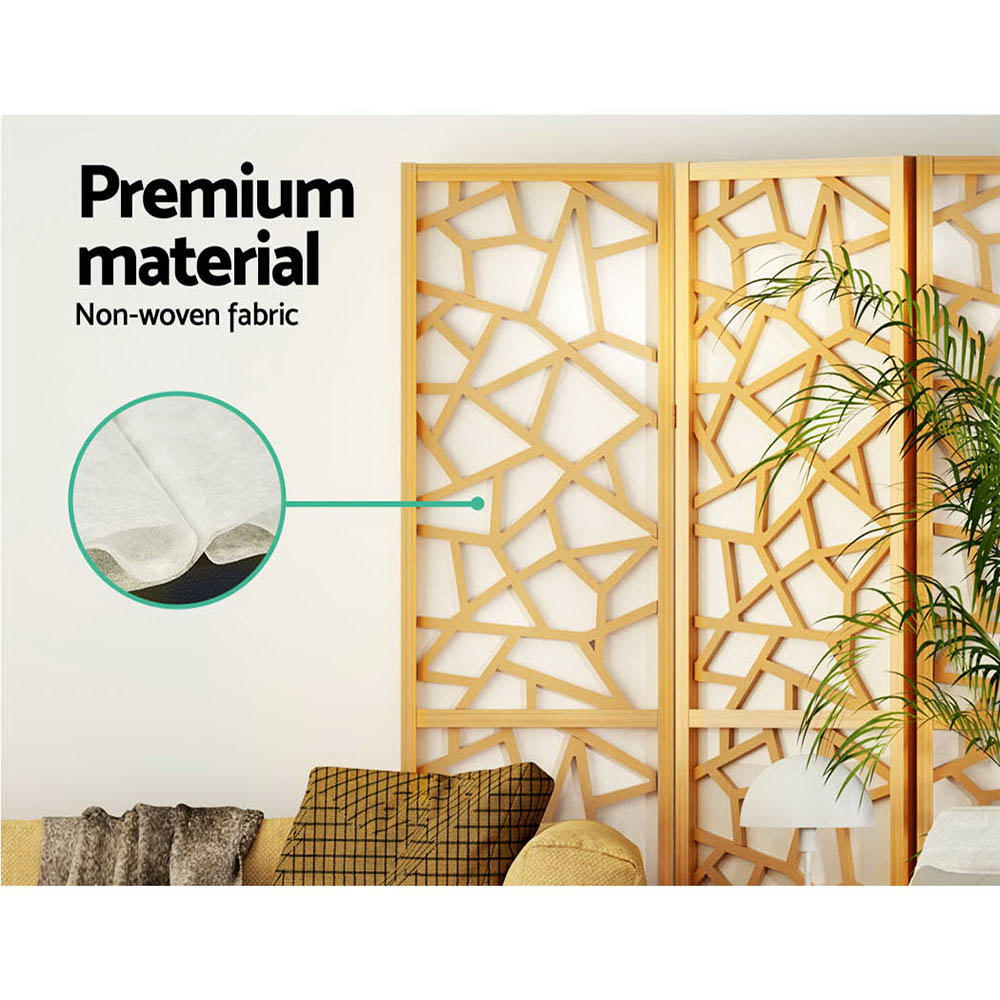 Natural pine 4-panel criss-cross geometric room divider non-woven fabric panel close-up in lifestyle room with palm plant