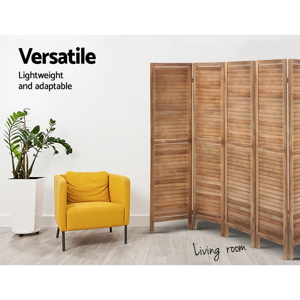 Natural 4-panel louvered wood room divider in living room lifestyle with yellow armchair and ZZ plant against white wall