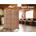 Natural 4-panel woven paper rope room divider in industrial office lifestyle with exposed ceiling beams and computer desks