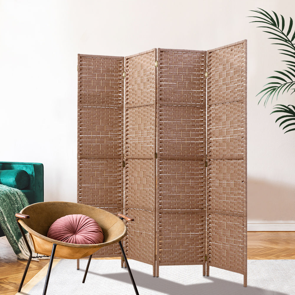 Natural 4-panel woven paper rope room divider in lifestyle room with teal velvet sofa rattan bowl chair and pink cushion