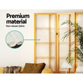 Natural pine crosshatch shoji room divider non-woven fabric close-up in lifestyle room with yellow sofa and palm plant