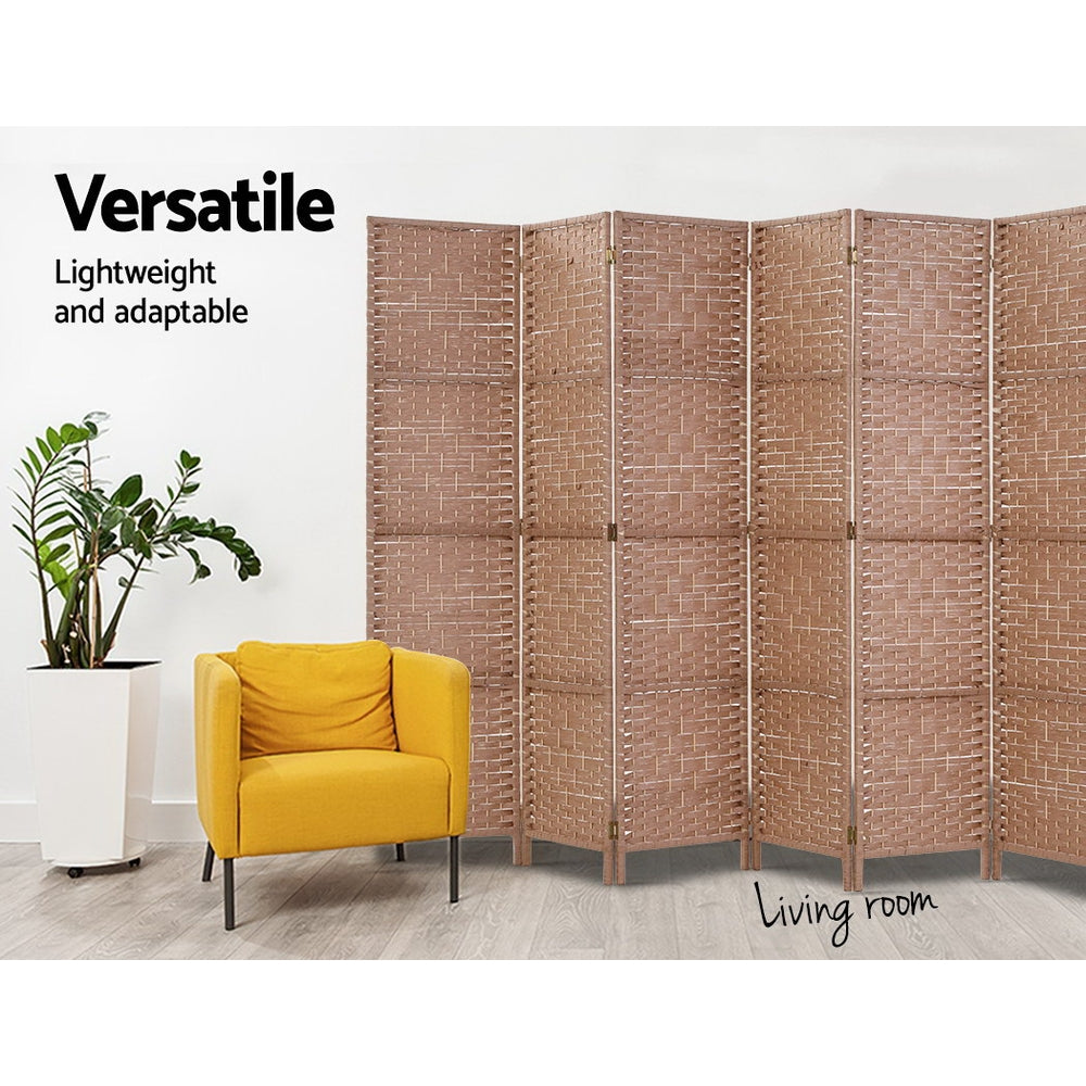 Natural 6-panel woven paper rope room divider in living room with yellow armchair and ZZ plant against white wall
