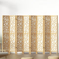 Natural pine 8-panel geometric MDF room divider with cutout pattern in lifestyle room with chair and ottomans