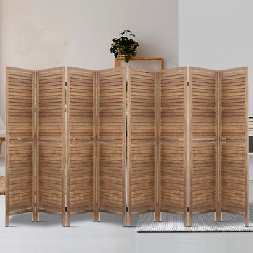 Natural 8-panel louvered wood room divider in lifestyle room with wooden ladder plant display shelf and cream area rug